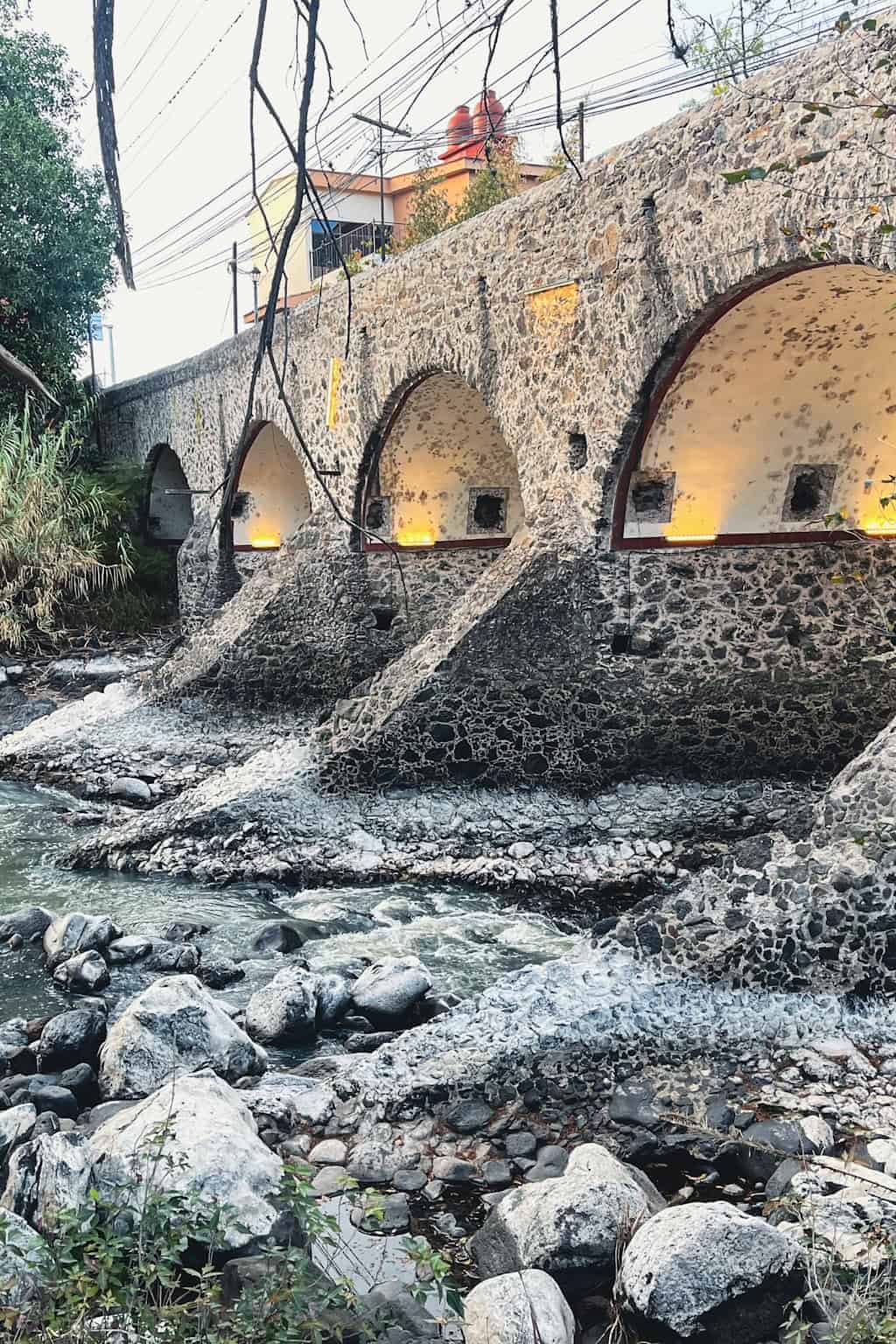 Stone bridge in Salvatierra, Guanajuato, surrounded by nature and river.
