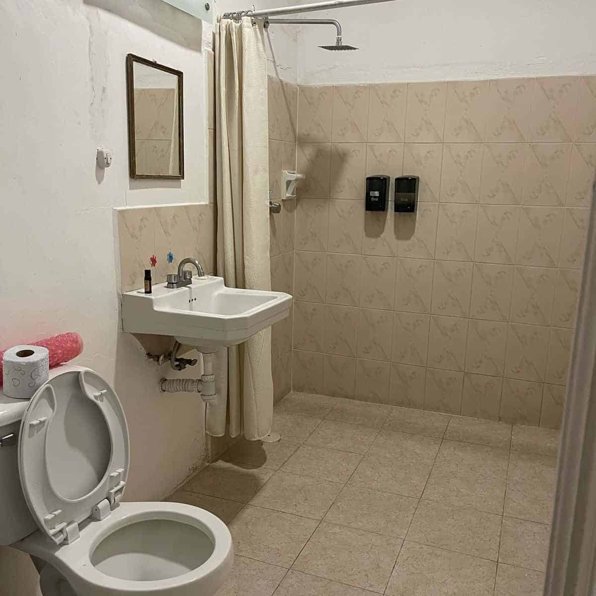 Public restroom with shower and toilet in Guanajuato, Mexico.