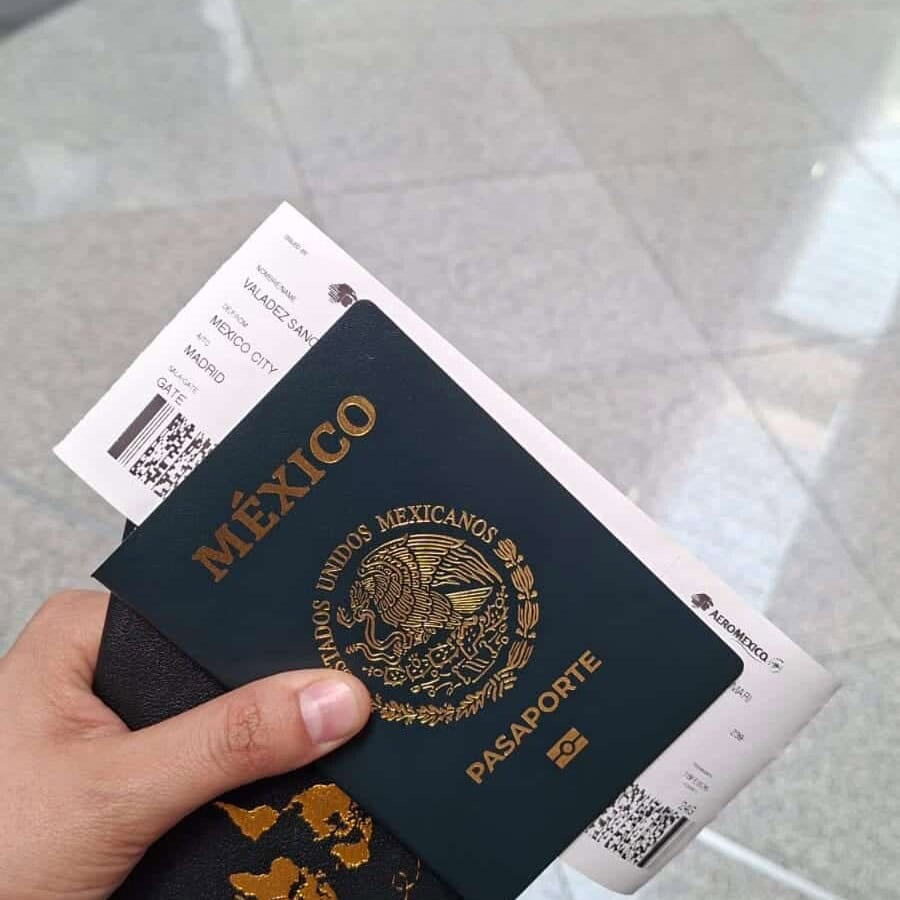 Mexican passport and plane ticket at Guanajuato airport, a popular tourist destination in Mexico.