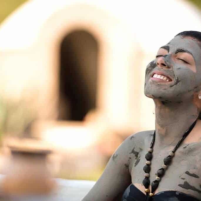 Woman enjoying a traditional bath in Guanajuato, a cultural and wellness tourist destination.