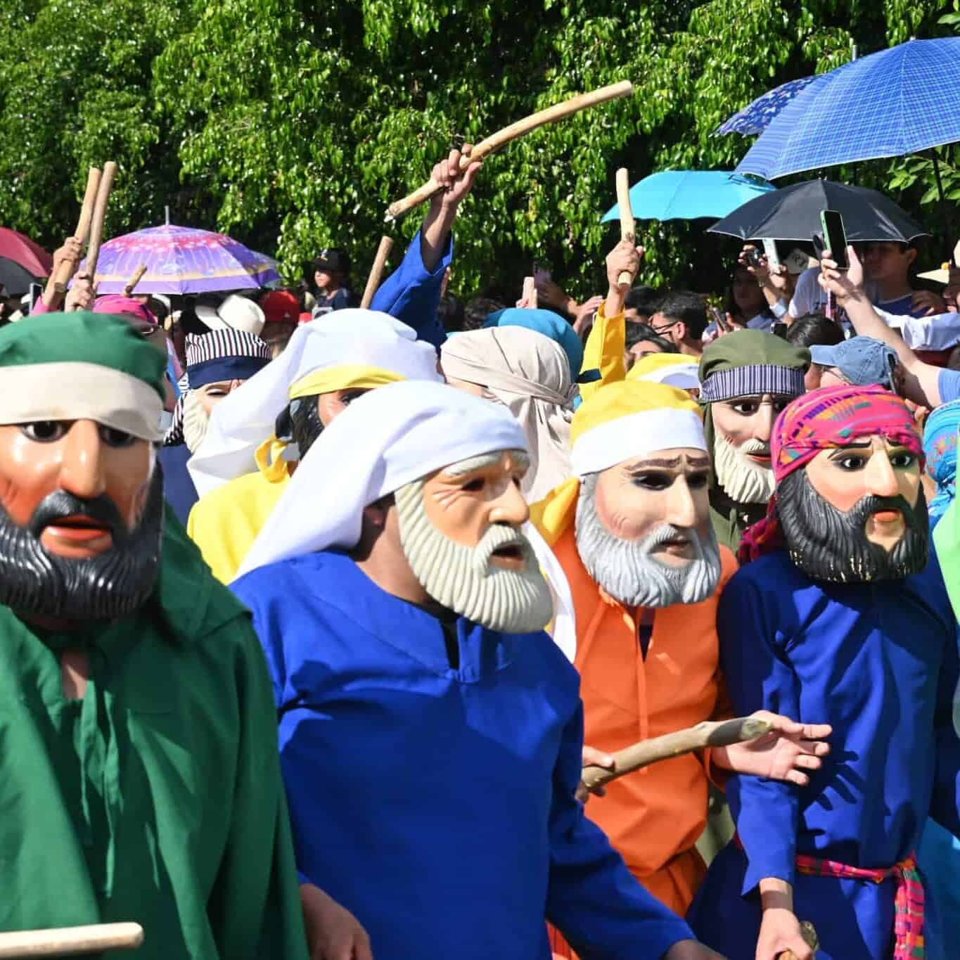 Masked figures in the traditional Judas procession in Guanajuato, during the celebration of.