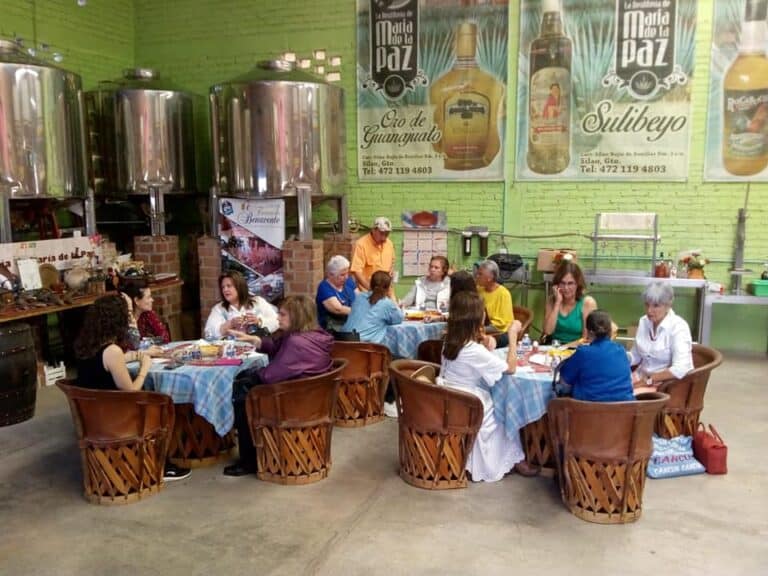 Group of people enjoying themselves at the María de la Paz Distillery in Guanajuato.