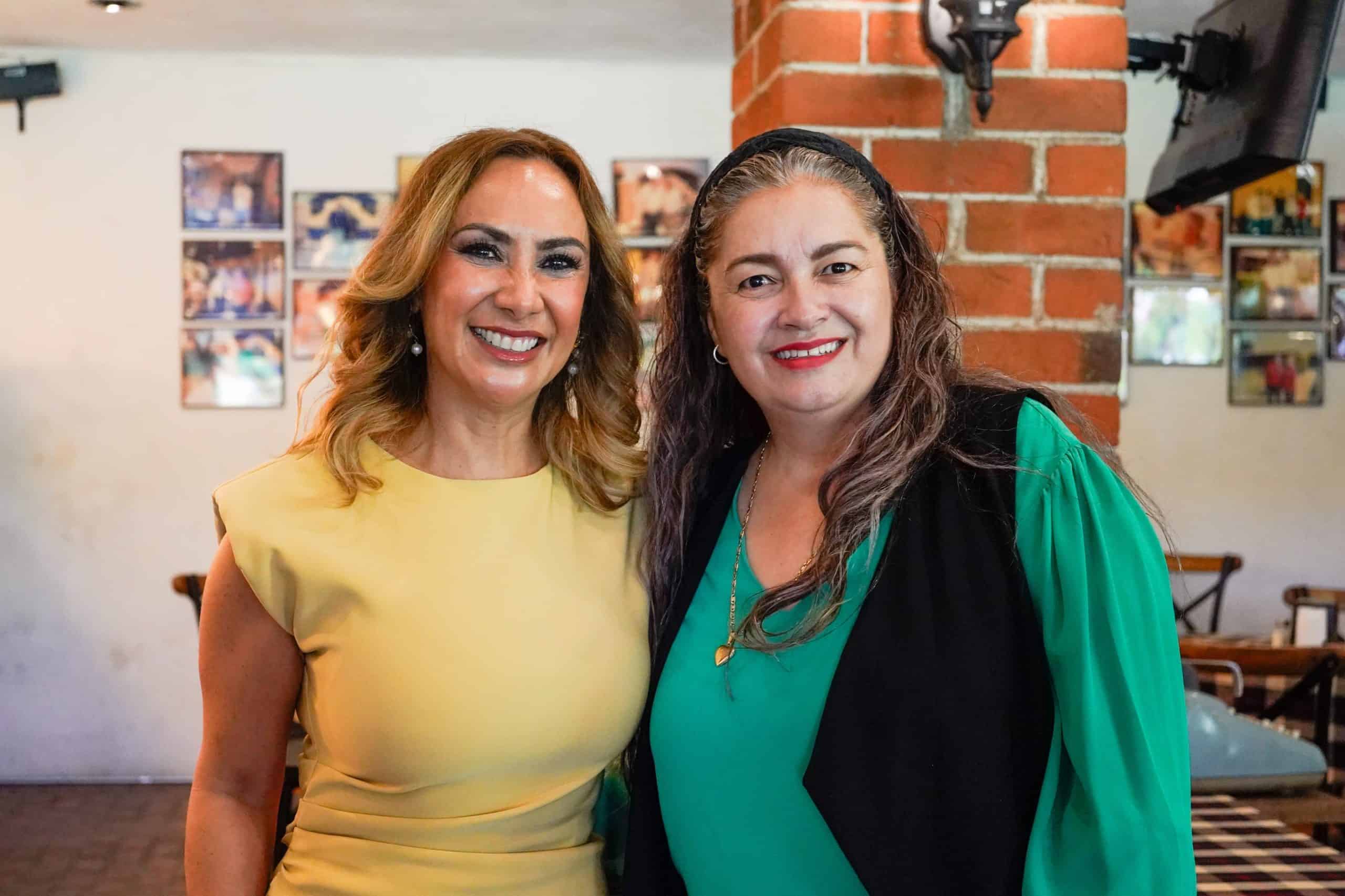 Two women smiling at a cultural event in Guanajuato, Mexico.