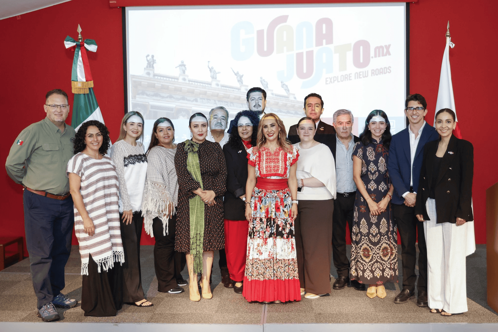 Group of people at a tourism promotion event in Japan with the Guanajuato flag.
