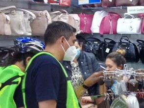 Participants of the bike tour in a leather bag shop in León, Guanajuato.