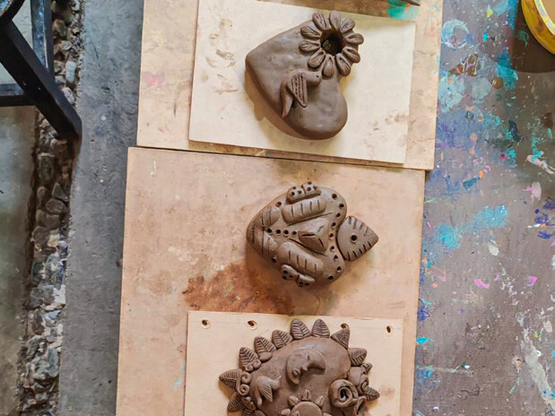 Handmade clay hearts and figures at Taller 23, Guanajuato.