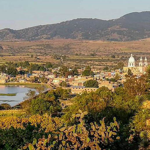 Panoramic view of Nuevo Valle de Moreno, its dam and the surrounding hills, León, Guanajuato.