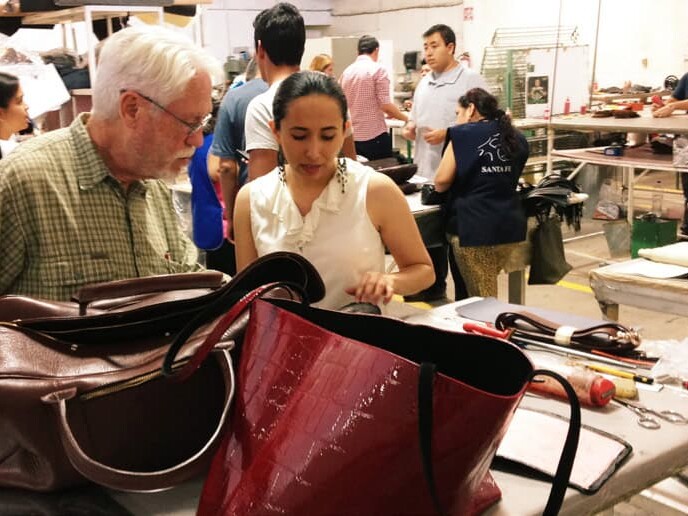 Visitors watch leather bags being made at a workshop in León, Guanajuato.