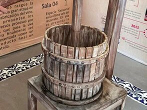 Old wooden grape press at the Wine Museum in Dolores Hidalgo.
