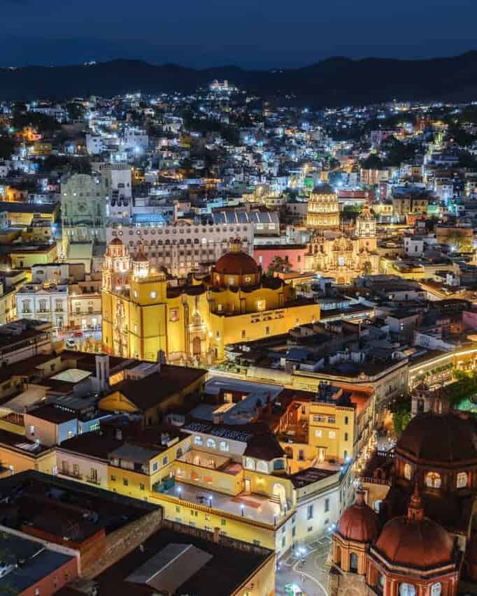 Night view of the city of Guanajuato with the illuminated Basilica of Our Lady of Guanajuato.